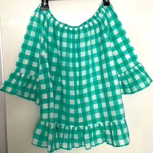 Green & white checked shirt.